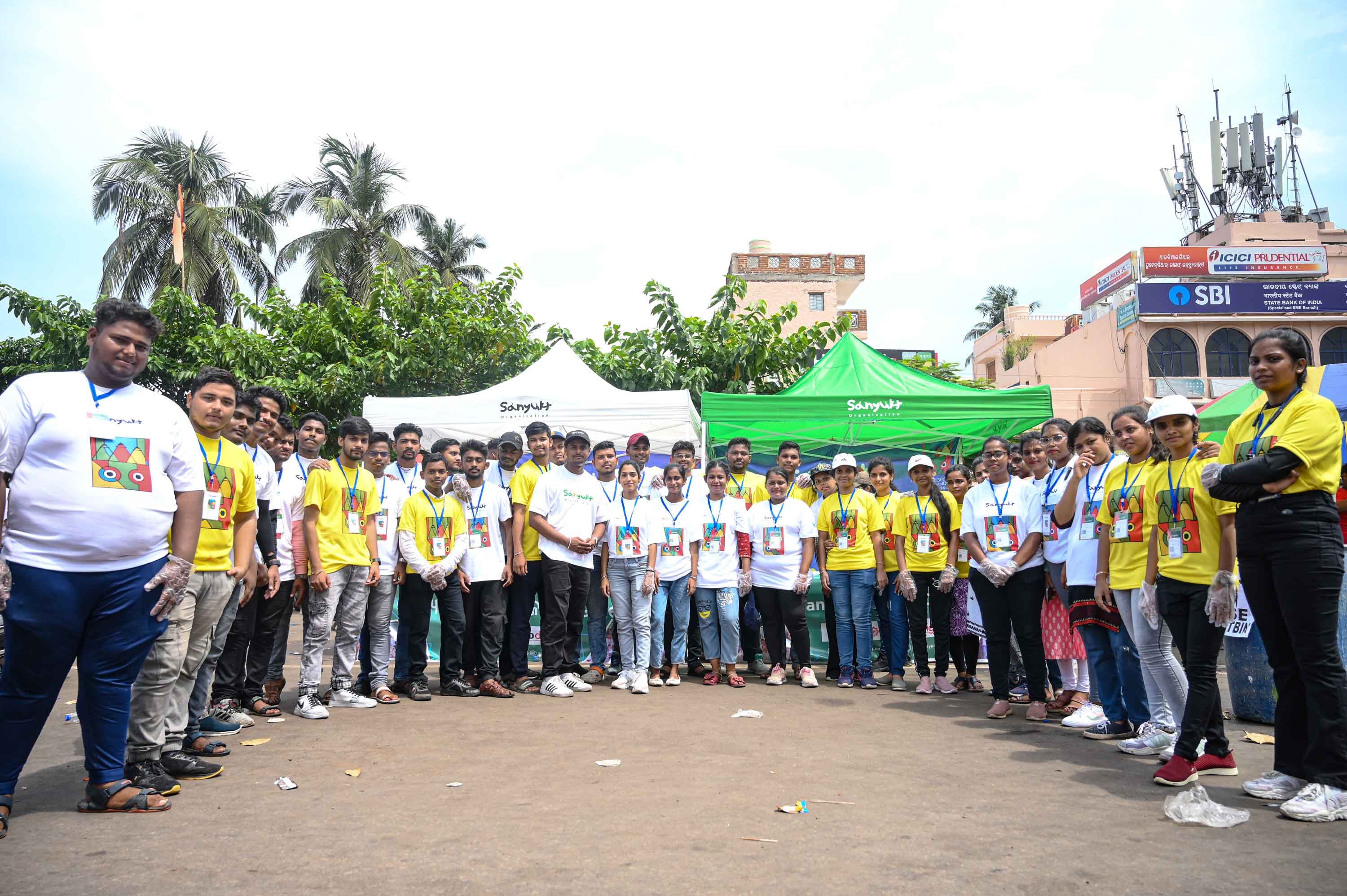 Sanyukt volunteers engaging with women and girls in an Odisha village
